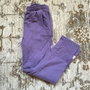 Disney purple sweats with fun patterns on front and back